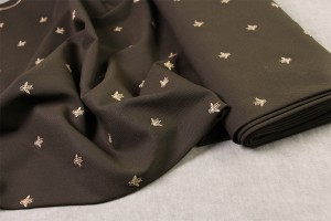 Тканина костюмно-плательна з вишивкою (мушки) Італія (вовна 100% коричнева, шир. 1,50 м)